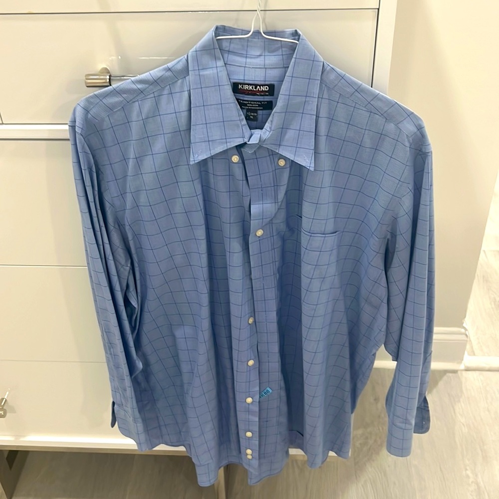 This is a Kirkland light blue dress shirt, size 17 1/2 X 3 2–33